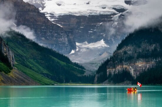 Canoe on Lake Louise in Alberta, Canada - Travel Deals from the USA - Wake Up Here
